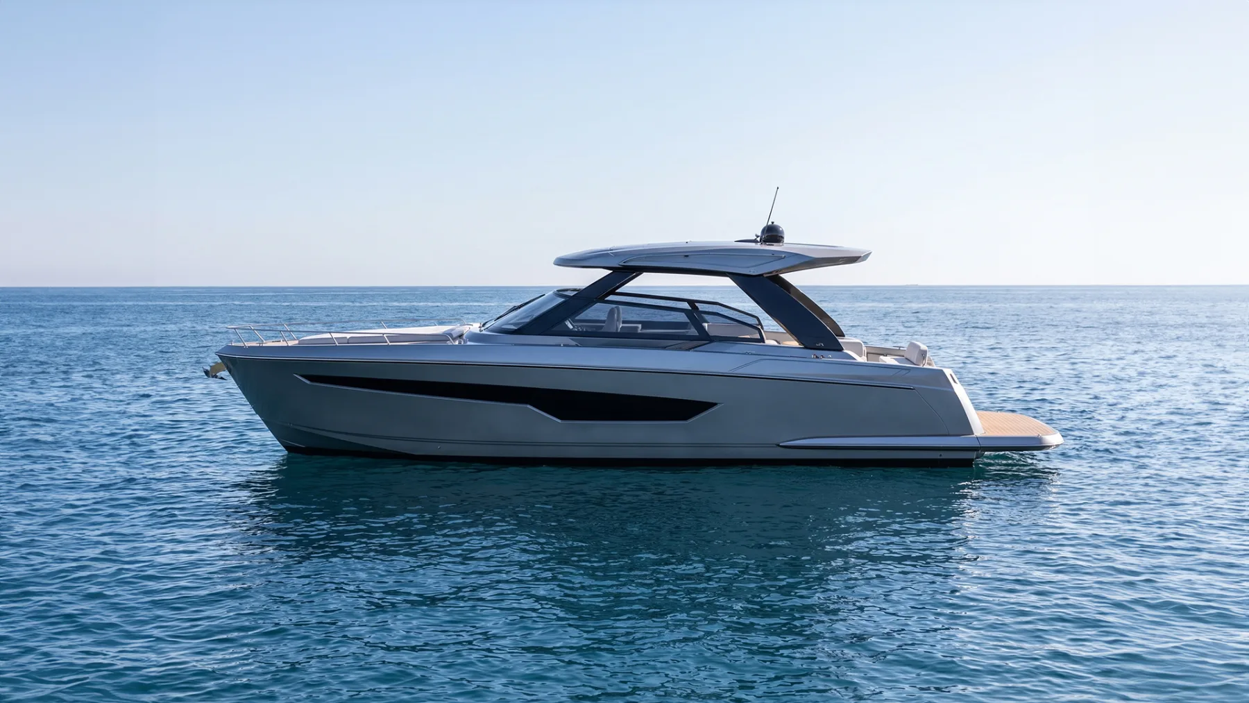 Nexo: A modern sport yacht with cabins below.